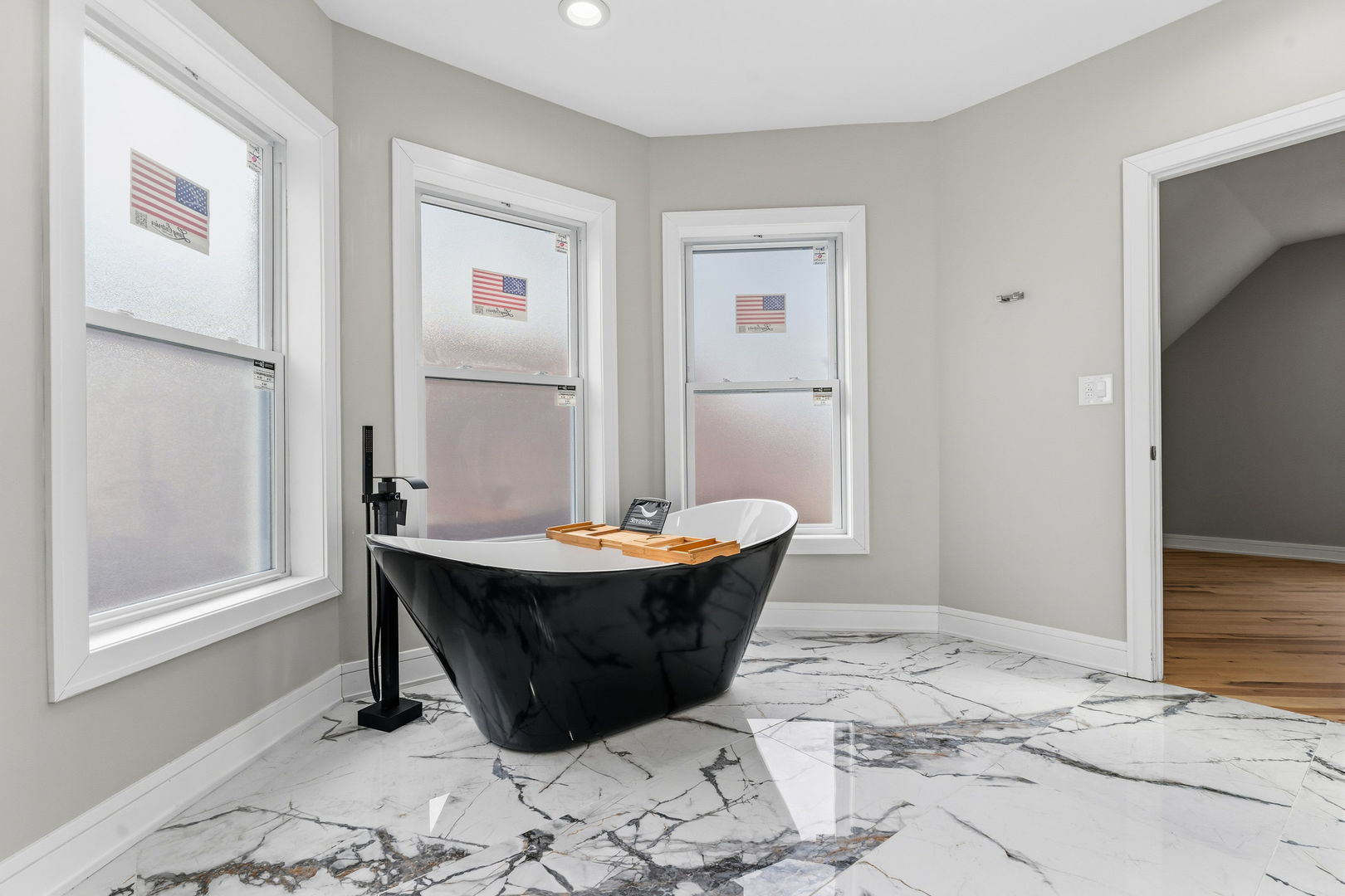 9410 South Champlain Avenue Chicago, IL 60619 - Photo 28 of 35 a room with a wooden floor and a window