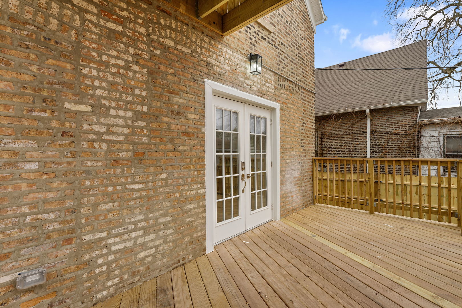 9410 South Champlain Avenue Chicago, IL 60619 - Photo 32 of 35 a view of a brick house with a wooden floor