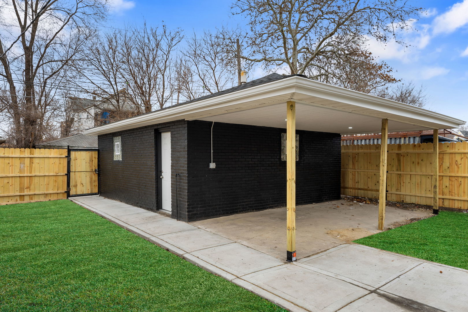 9410 South Champlain Avenue Chicago, IL 60619 - Photo 34 of 35 a view of a house with a backyard