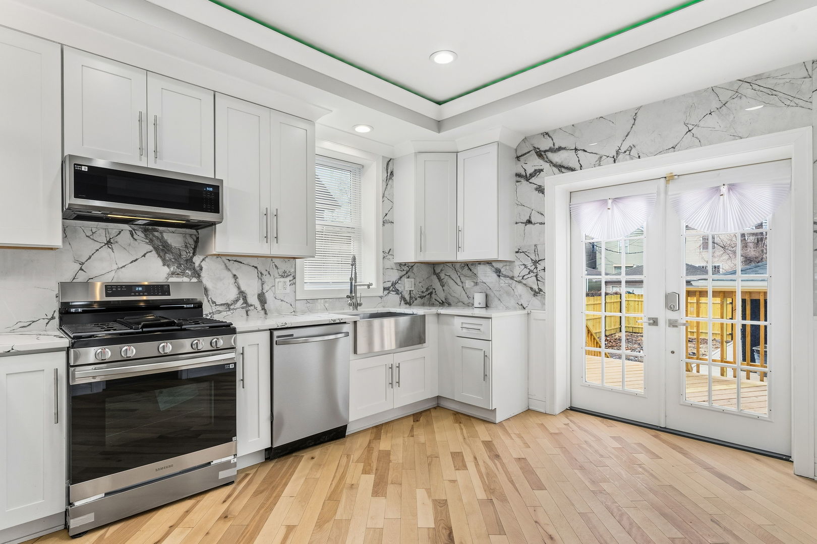 9410 South Champlain Avenue Chicago, IL 60619 - Photo 9 of 35 a kitchen with a stove oven and a sink