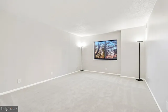 a view of a house with a yard and garden