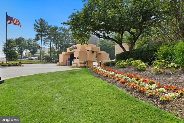 a view of a cars park in front of a house