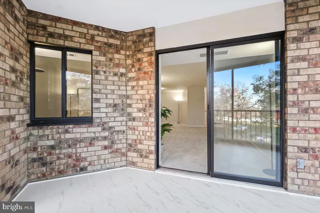 a kitchen with white cabinets and sink