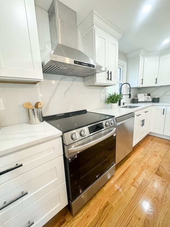 12 Evelyn Road Beverly, MA 01915 - Photo 12 of 37 a kitchen with white cabinets and appliances