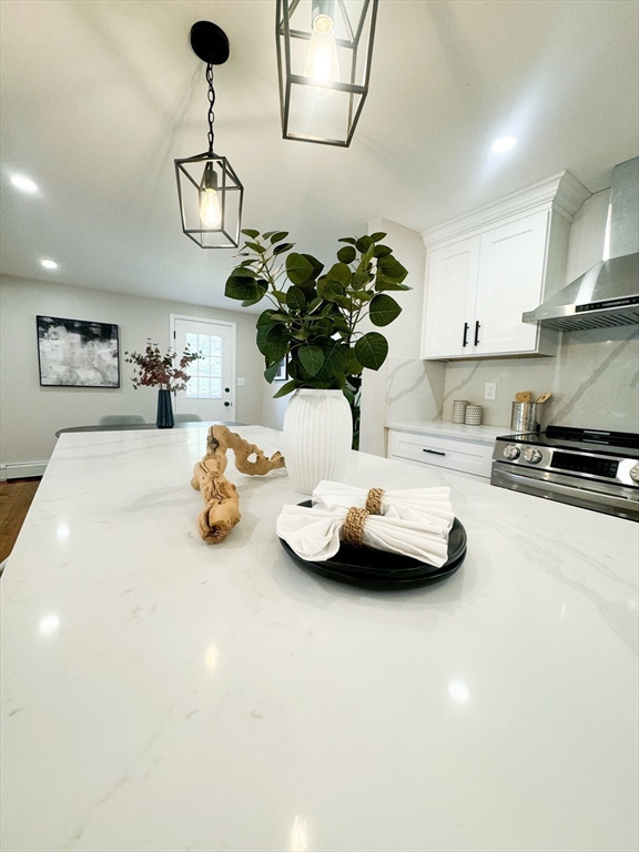 12 Evelyn Road Beverly, MA 01915 - Photo 14 of 37 a kitchen with a sink and chandelier