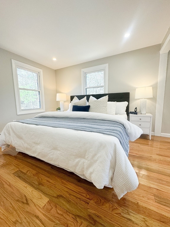 12 Evelyn Road Beverly, MA 01915 - Photo 18 of 37 a bedroom with a bed and wooden floor