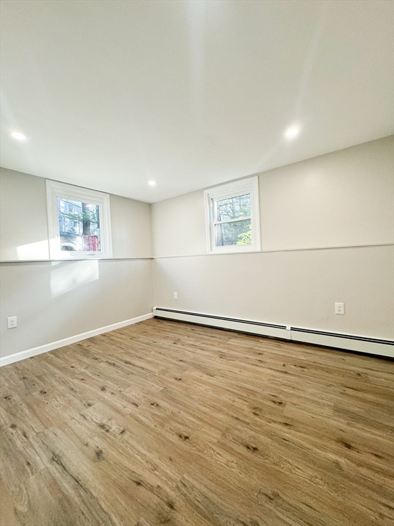12 Evelyn Road Beverly, MA 01915 - Photo 29 of 37 an empty room with wooden floor and windows