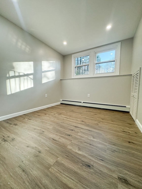 12 Evelyn Road Beverly, MA 01915 - Photo 30 of 37 an empty room with wooden floor and windows