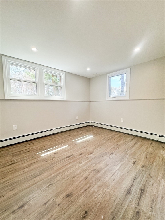 12 Evelyn Road Beverly, MA 01915 - Photo 31 of 37 an empty room with wooden floor and windows