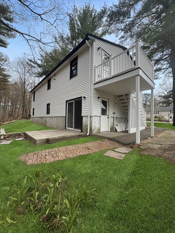 12 Evelyn Road Beverly, MA 01915 - Photo 32 of 37 a view of a house with a yard and sitting area