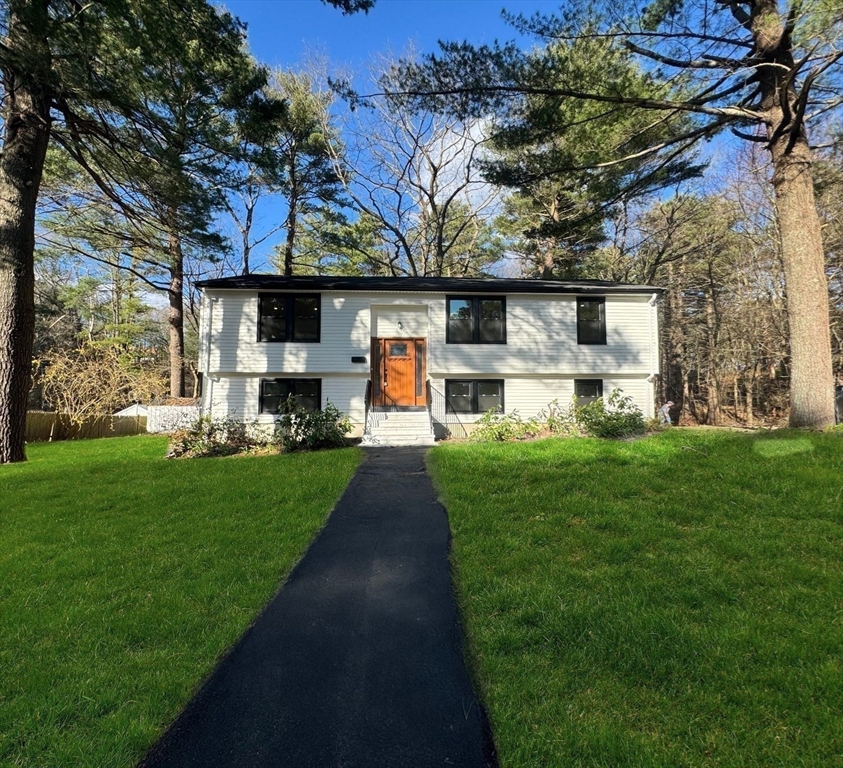 12 Evelyn Road Beverly, MA 01915 - Photo 37 of 37 a front view of a house with a yard and garage