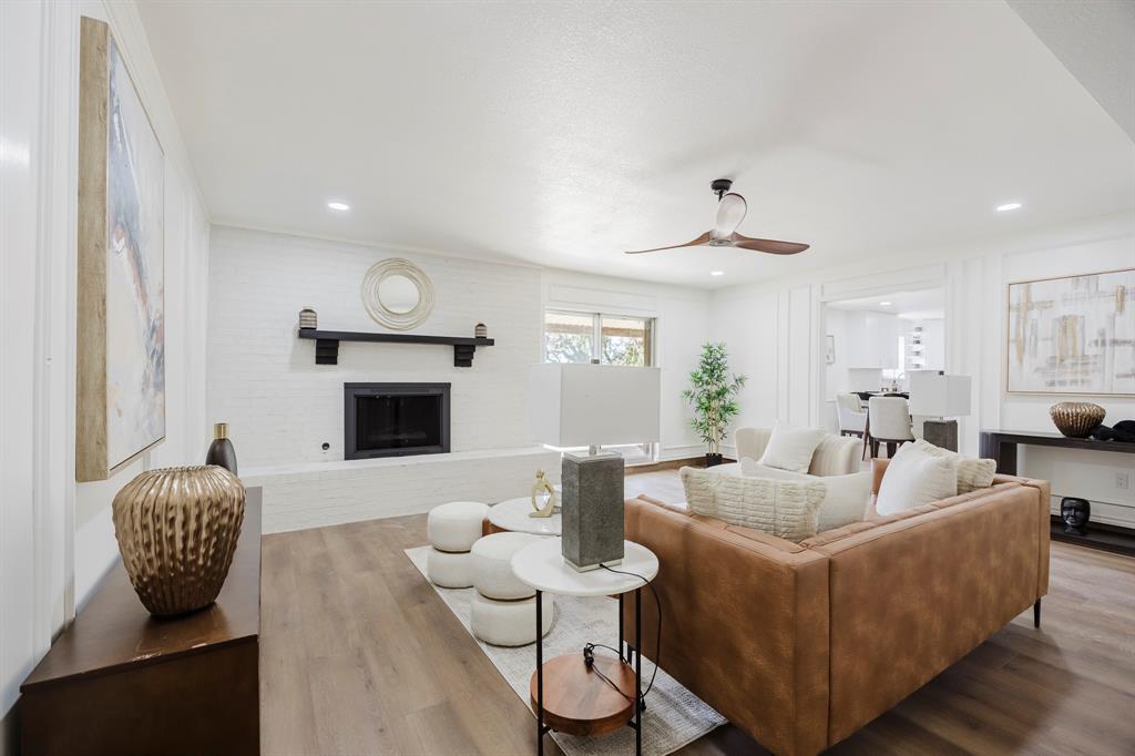 a living room with furniture or couch and a fireplace