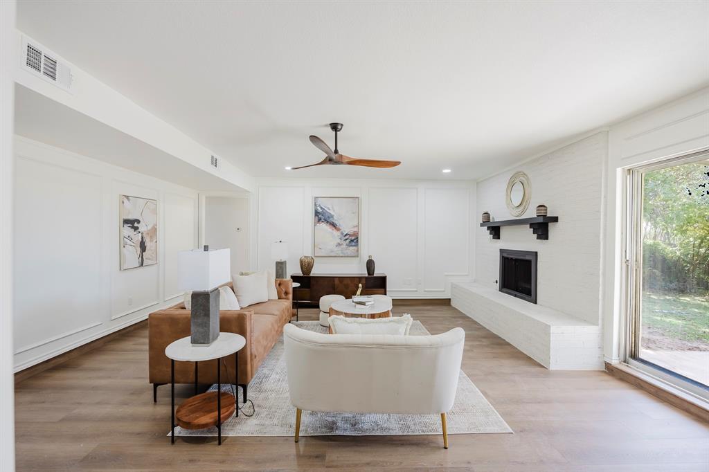 2120 Fairfax Road Denton, TX 76205 - Photo 4 of 23 a living room with furniture and a fireplace