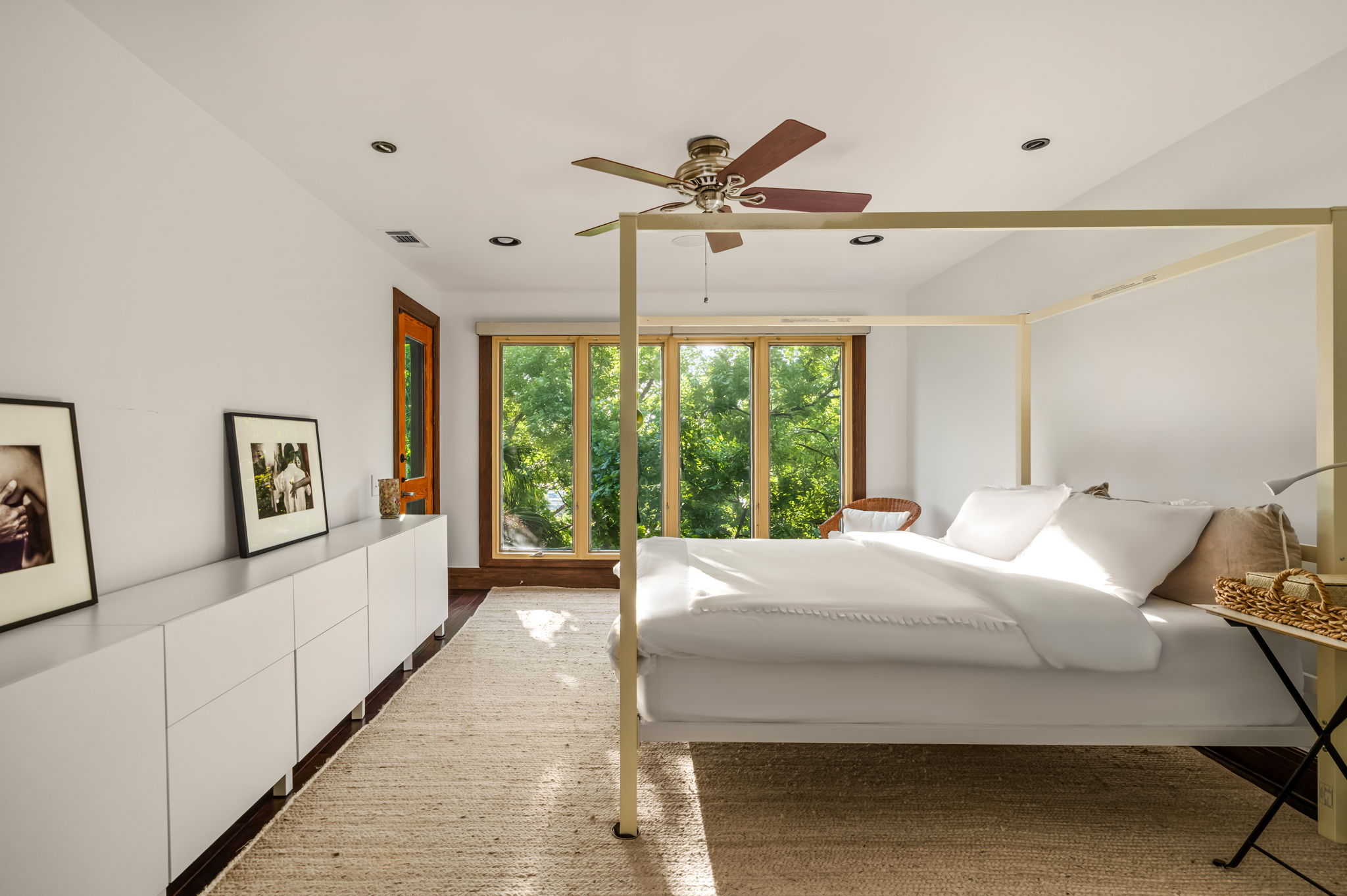1111 West 12th Street, Unit 107 Austin, TX 78703 - Photo 27 of 38 Bright room with wood-finish flooring, recessed lighting, and a ceiling fan