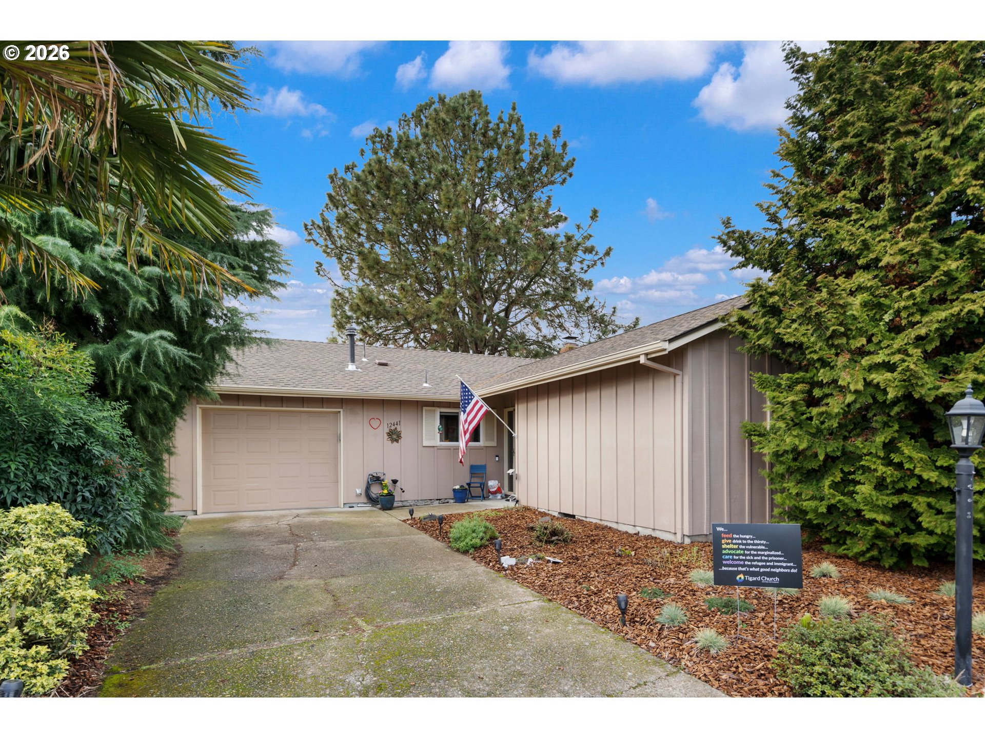 12441 Southwest King George Drive Portland, OR 97224 - Photo 1 of 36 a backyard of a house with table and chairs