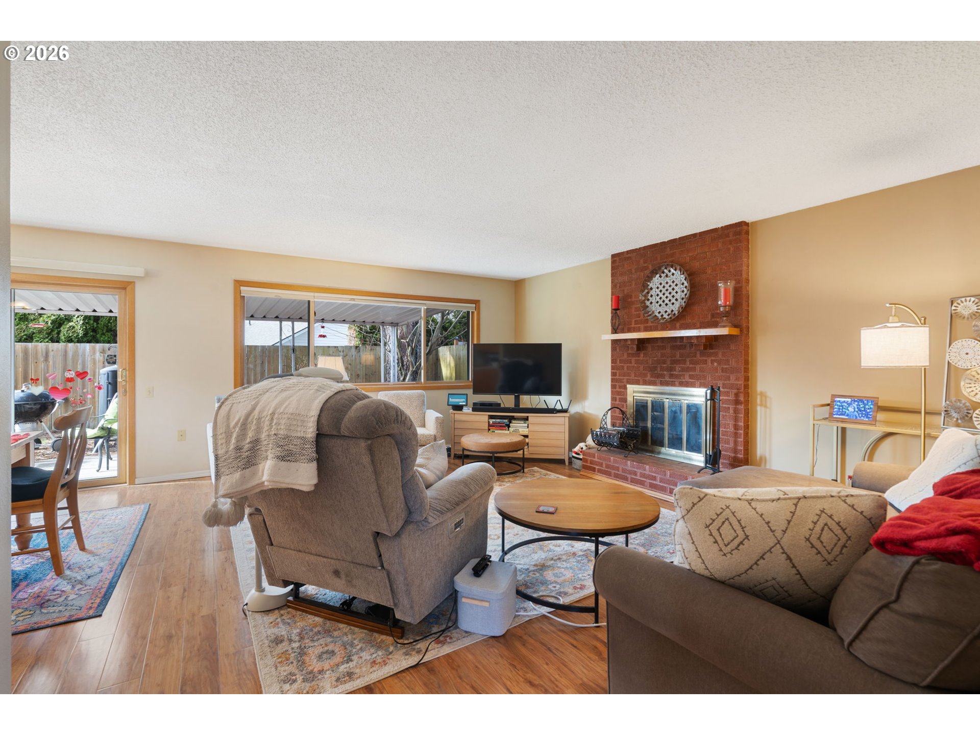 12441 Southwest King George Drive Portland, OR 97224 - Photo 11 of 36 a living room with furniture and a floor to ceiling window