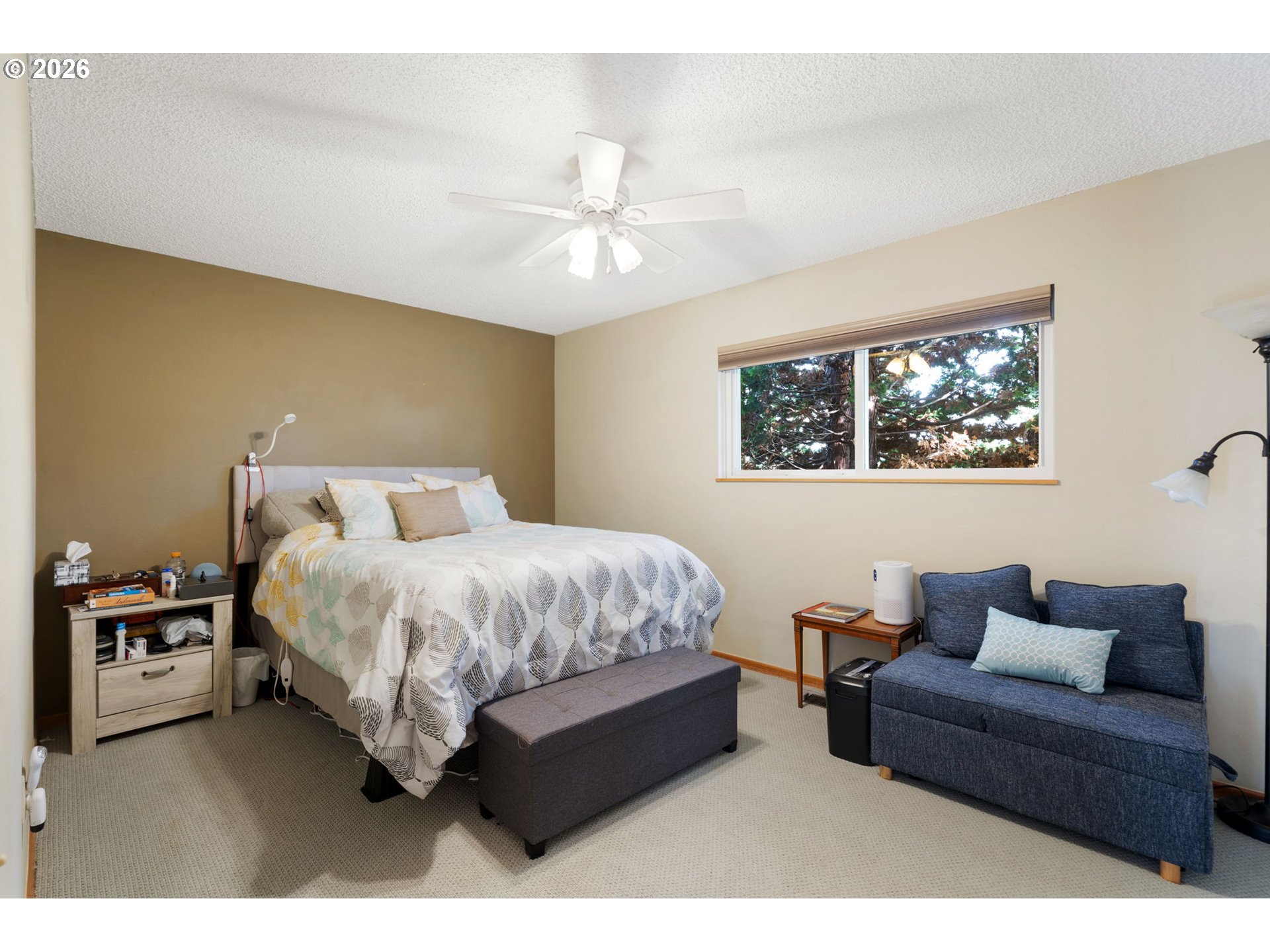 12441 Southwest King George Drive Portland, OR 97224 - Photo 12 of 36 a spacious bedroom with a bed and a couch
