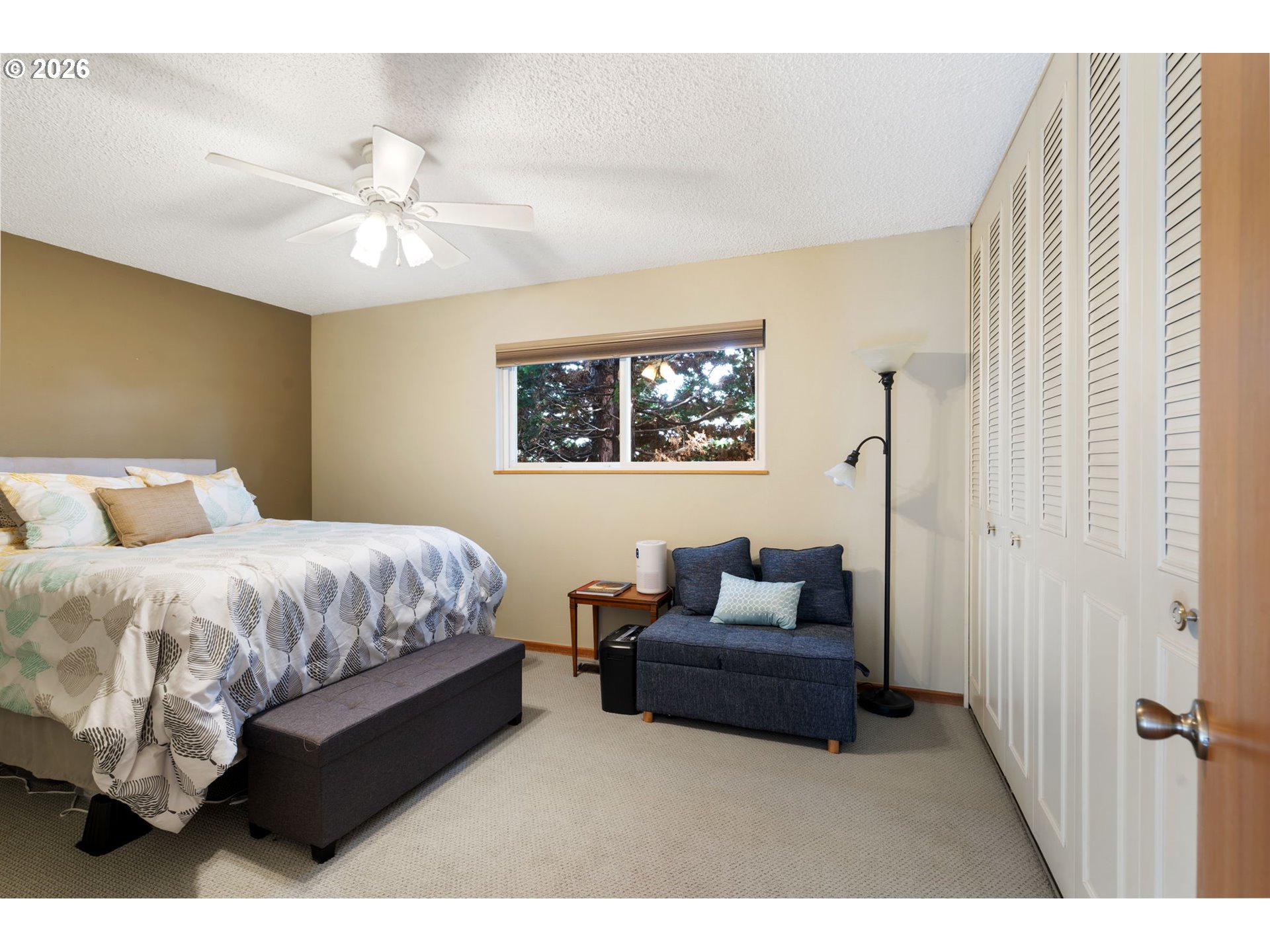 12441 Southwest King George Drive Portland, OR 97224 - Photo 13 of 36 a bedroom with a bed mirror and couch