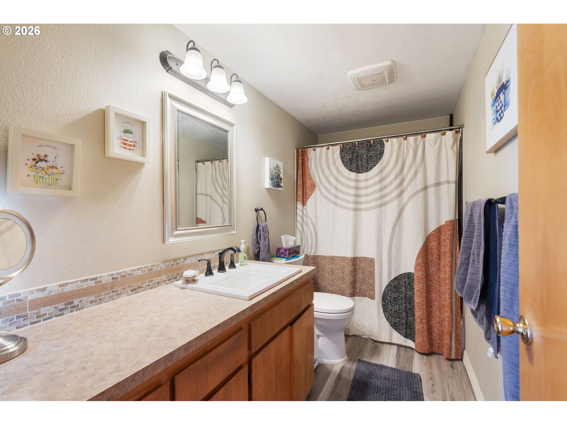 12441 Southwest King George Drive Portland, OR 97224 - Photo 16 of 36 a bathroom with a sink vanity granite and a mirror