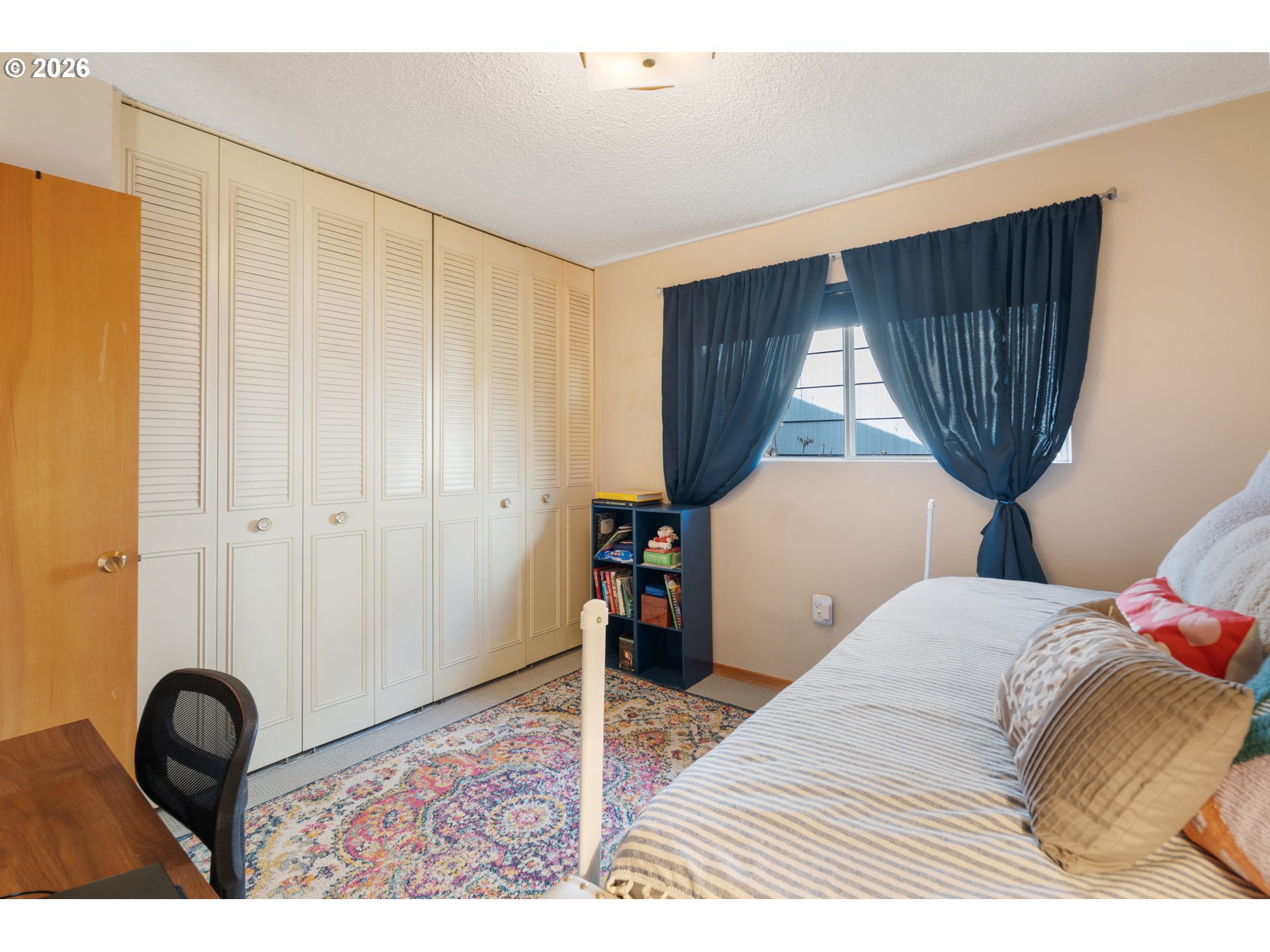 12441 Southwest King George Drive Portland, OR 97224 - Photo 21 of 36 a bedroom with a bed and a dresser in it