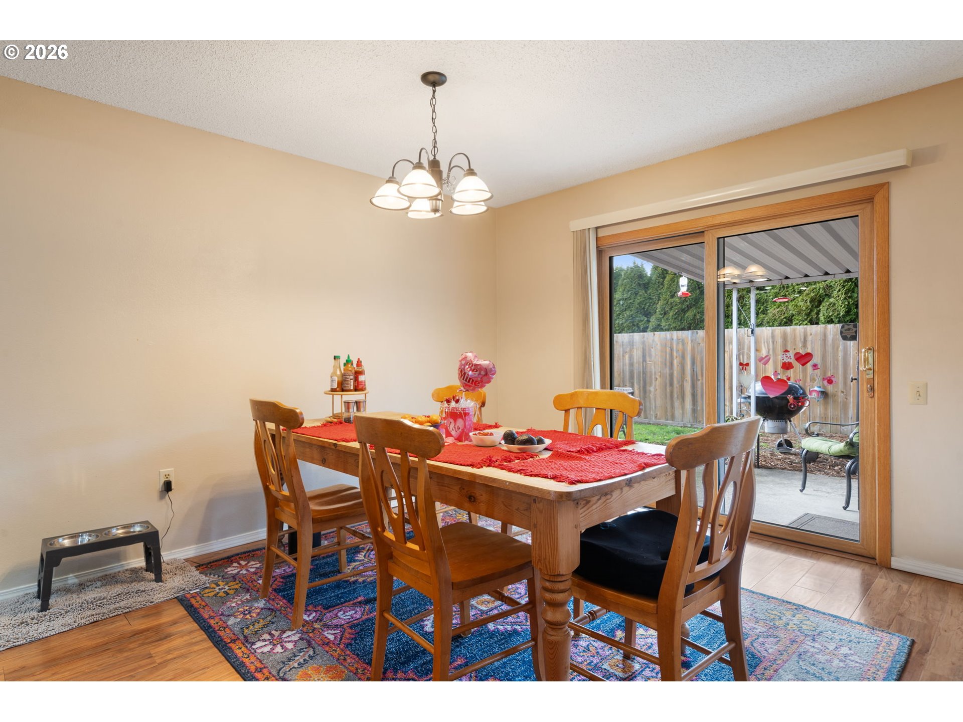 12441 Southwest King George Drive Portland, OR 97224 - Photo 28 of 36 a dining room with furniture a chandelier and wooden floor