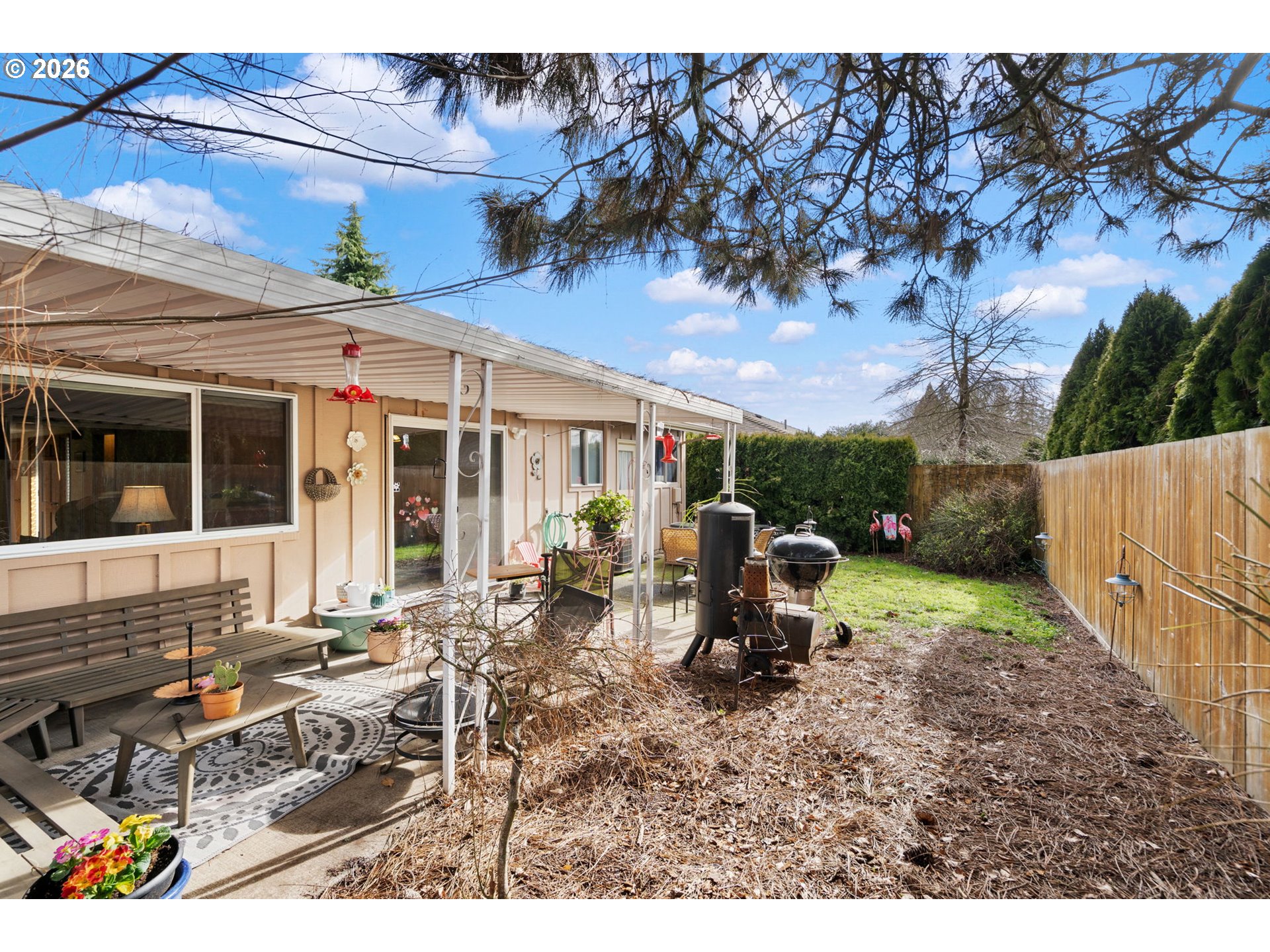 12441 Southwest King George Drive Portland, OR 97224 - Photo 34 of 36 a view of a house with backyard sitting area and garden
