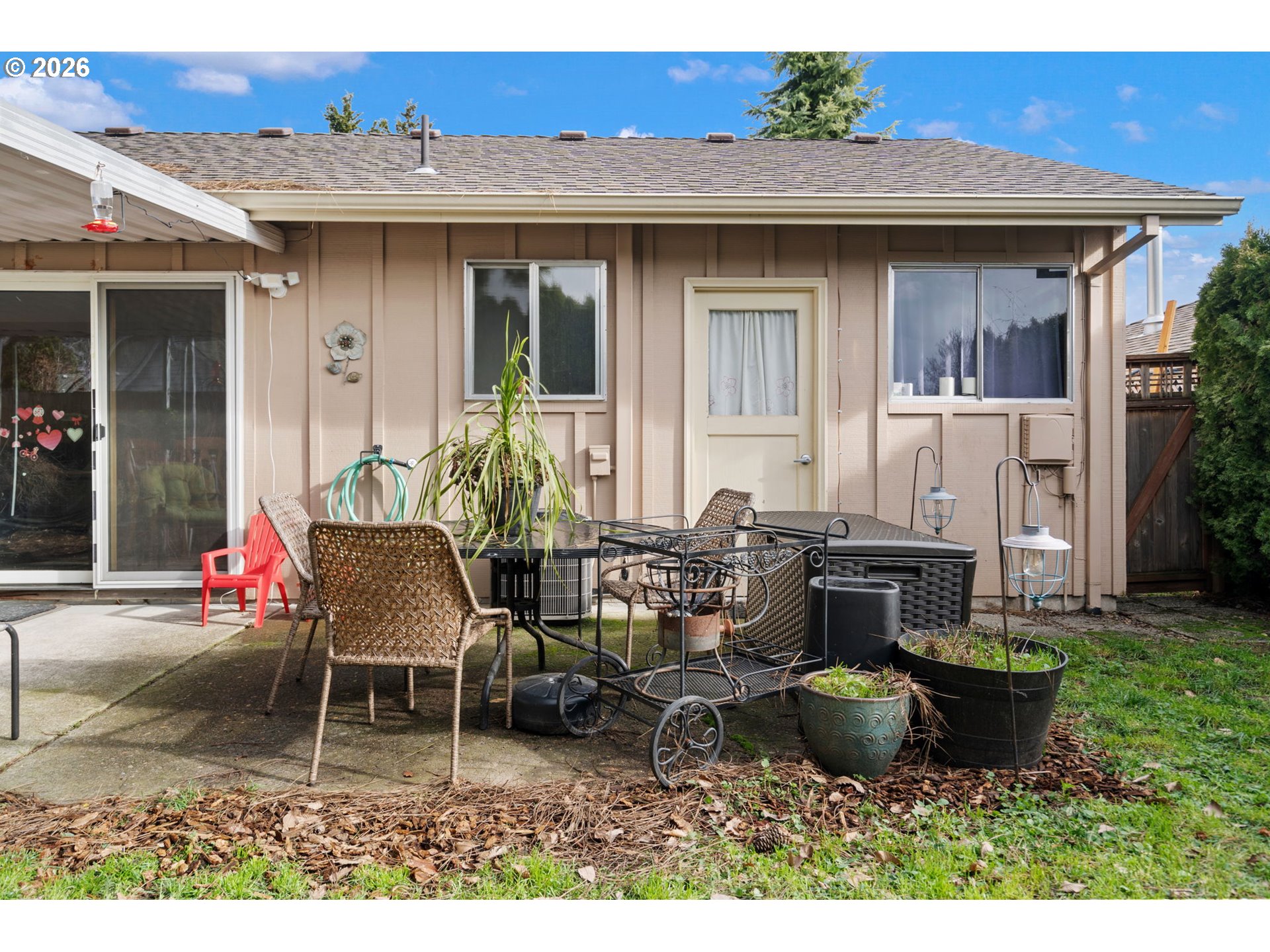 12441 Southwest King George Drive Portland, OR 97224 - Photo 35 of 36 a view of a patio with couple of chairs and a fountain