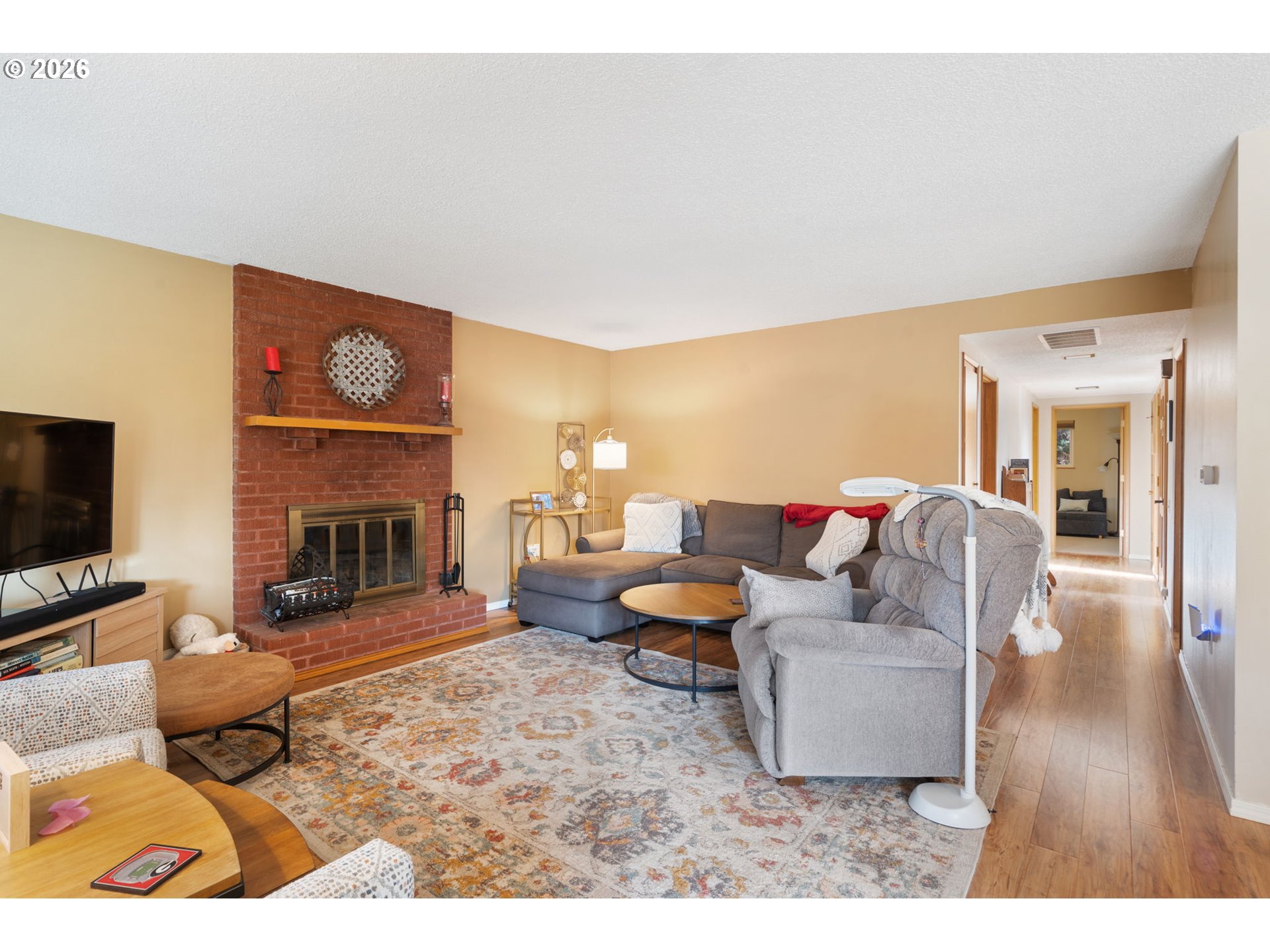 12441 Southwest King George Drive Portland, OR 97224 - Photo 10 of 36 a living room with furniture and a fireplace