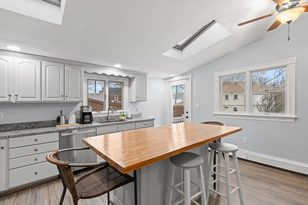 3 Smith Avenue Methuen, MA 01844 - Photo 16 of 38 a kitchen with a table chairs cabinets and wooden floor