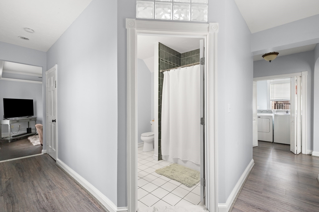 3 Smith Avenue Methuen, MA 01844 - Photo 18 of 38 a view of a hallway with wooden floor and a living room