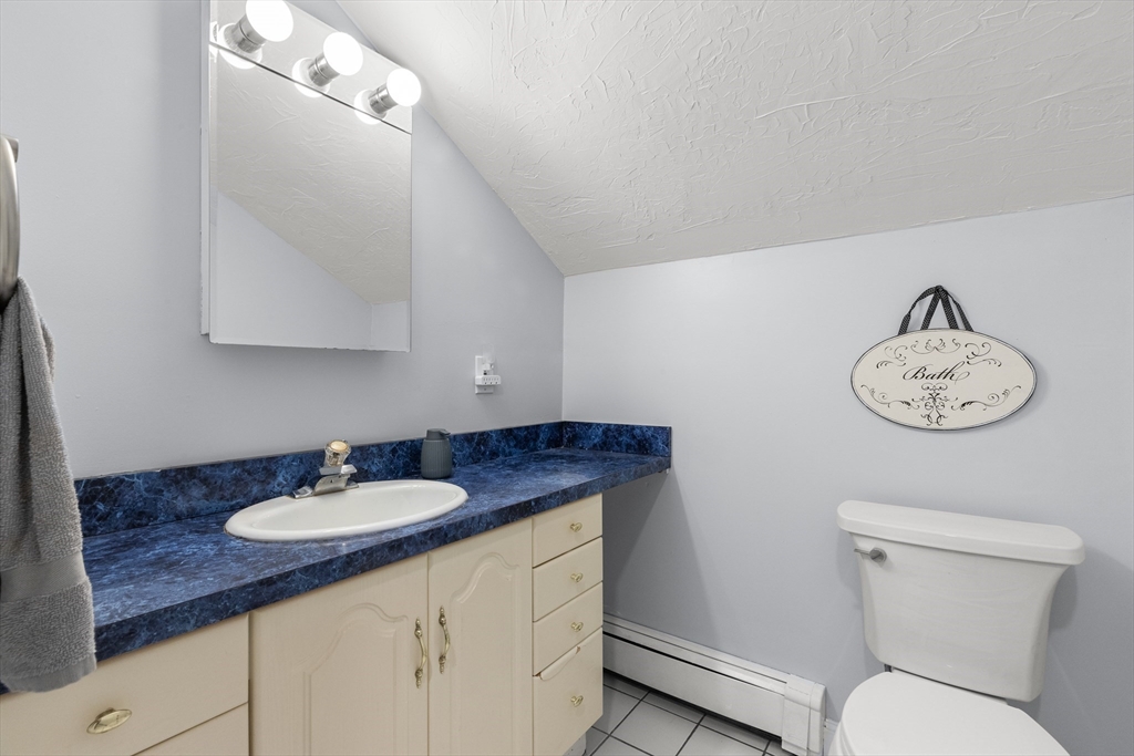 3 Smith Avenue Methuen, MA 01844 - Photo 24 of 38 a bathroom with a sink a toilet and a mirror