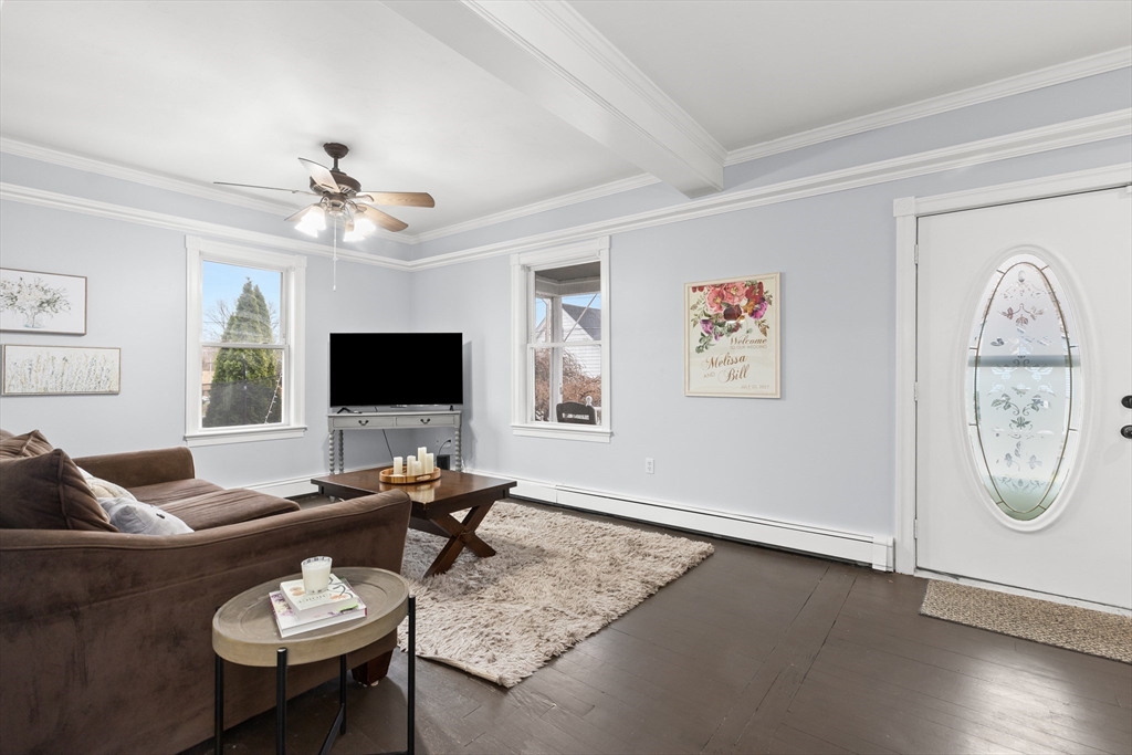 3 Smith Avenue Methuen, MA 01844 - Photo 4 of 38 a living room with furniture a flat screen tv and a window