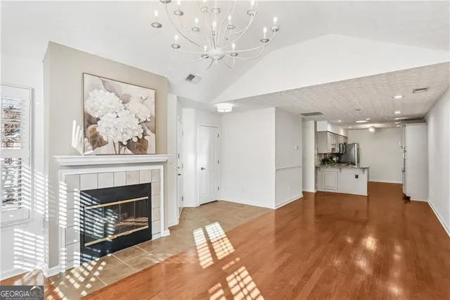 a view of an empty room with a fireplace