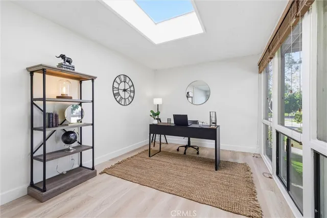 a view of a livingroom with furniture and a window