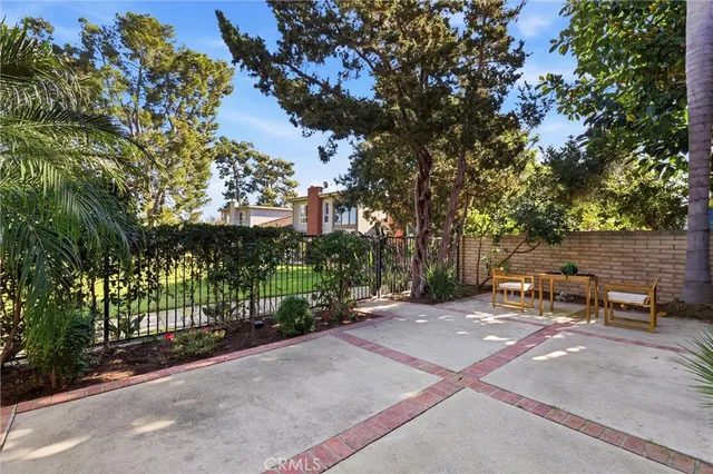 a tree in front of a house