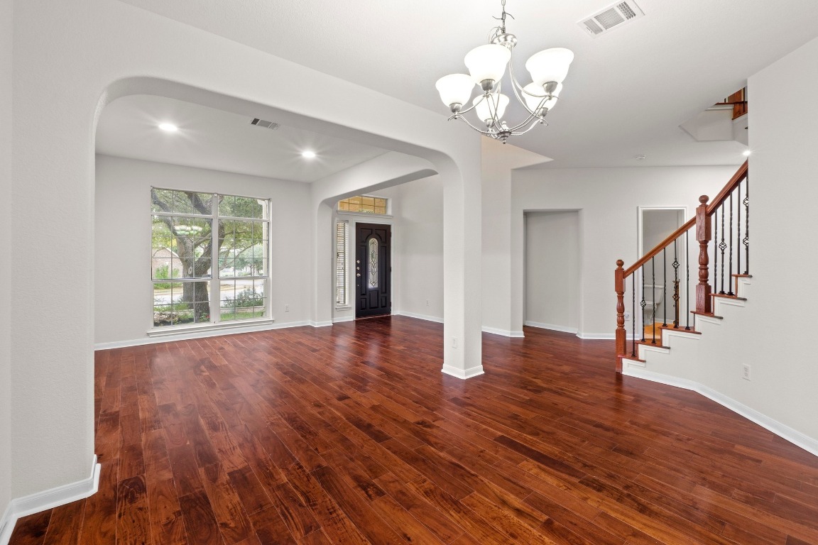 3228 Ranch Park Trail Round Rock, TX 78681 - Photo 15 of 40 Living and dining rooms on first floor complete with chandelier and recessed can lighting.
