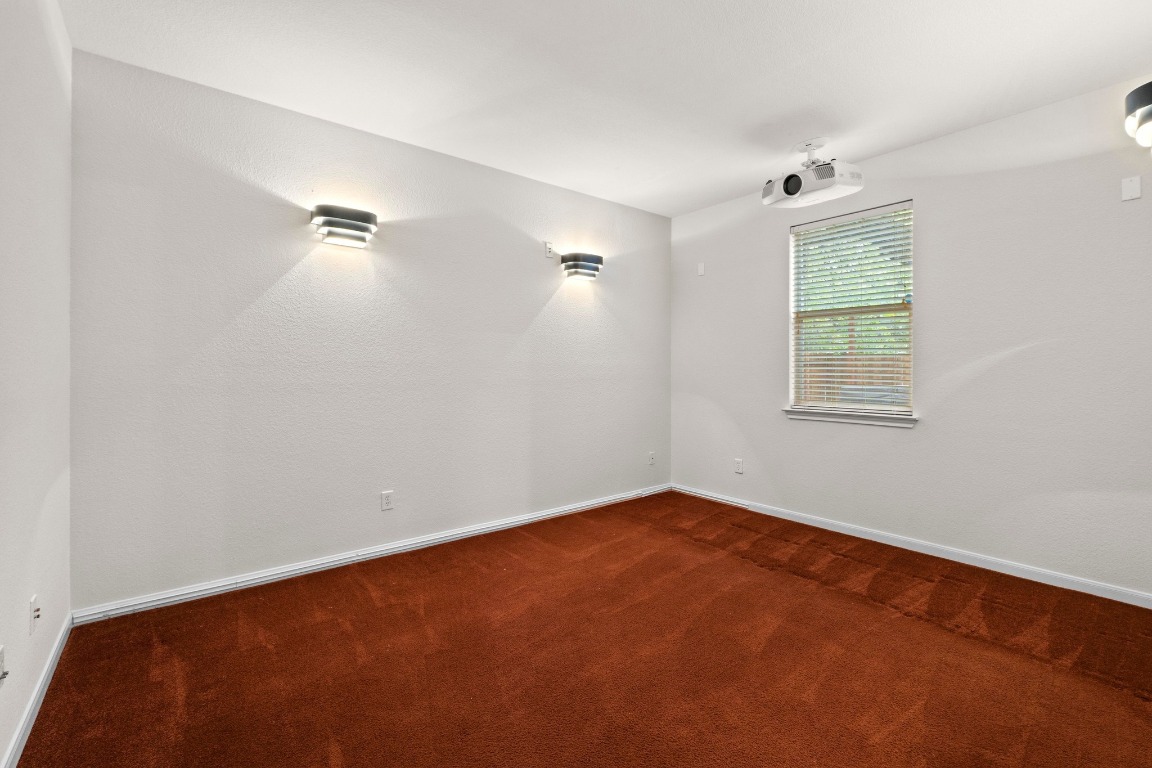 3228 Ranch Park Trail Round Rock, TX 78681 - Photo 18 of 40 This downstairs room is set up as a media room but could also be a study or other bedroom.