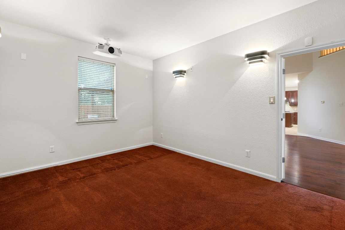 3228 Ranch Park Trail Round Rock, TX 78681 - Photo 19 of 40 This downstairs room is set up as a media room but could also be a study or other bedroom.