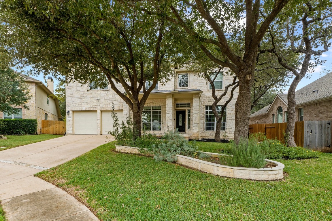 3228 Ranch Park Trail Round Rock, TX 78681 - Photo 4 of 40 Austin lime stone exterior with covered porch and a 2.5 car garage.