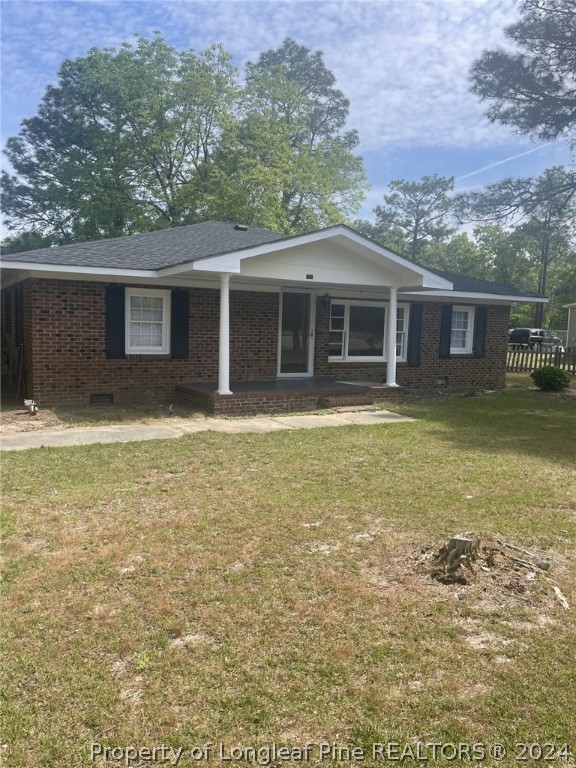 1276 Loop Road Raeford, NC 28376 - Photo 1 of 11 a view of a house with a yard