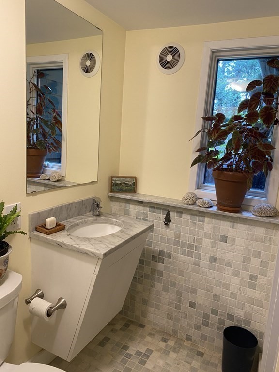 18 Brooksweld Road Canton, MA 02021 - Photo 10 of 19 a bathroom with a sink a toilet and mirror