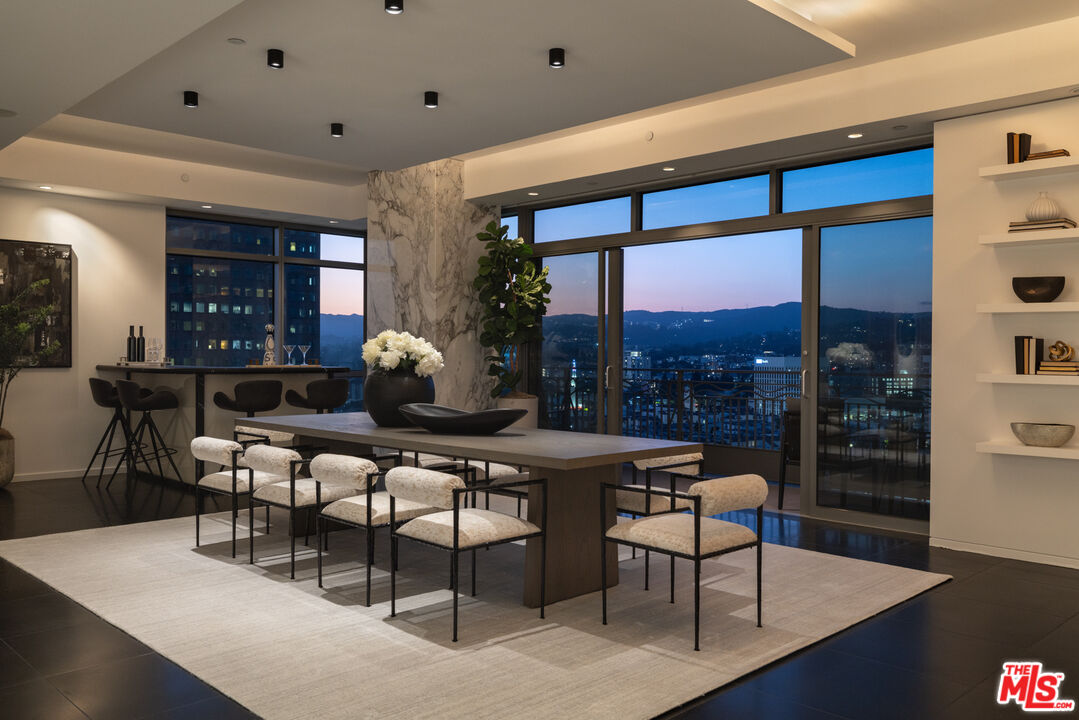 10800 Wilshire Boulevard, Unit 1501 Los Angeles, CA 90024 - Photo 16 of 17 a dining room with furniture and wooden floor