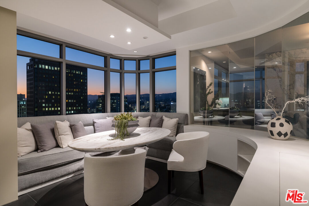 10800 Wilshire Boulevard, Unit 1501 Los Angeles, CA 90024 - Photo 17 of 17 a living room with furniture and large windows