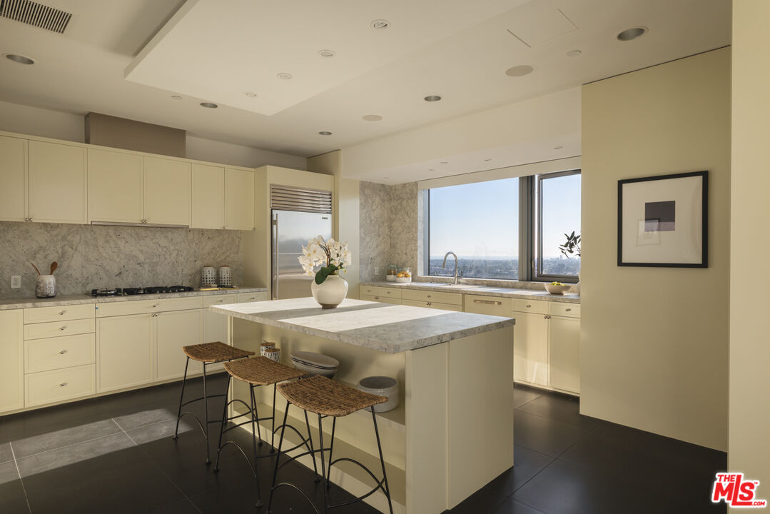 10800 Wilshire Boulevard, Unit 1501 Los Angeles, CA 90024 - Photo 4 of 17 a kitchen with stainless steel appliances granite countertop a sink and a refrigerator