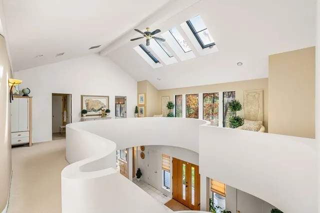 a large white bed in a white room