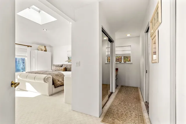 a kitchen with a sink and a stove next to a window