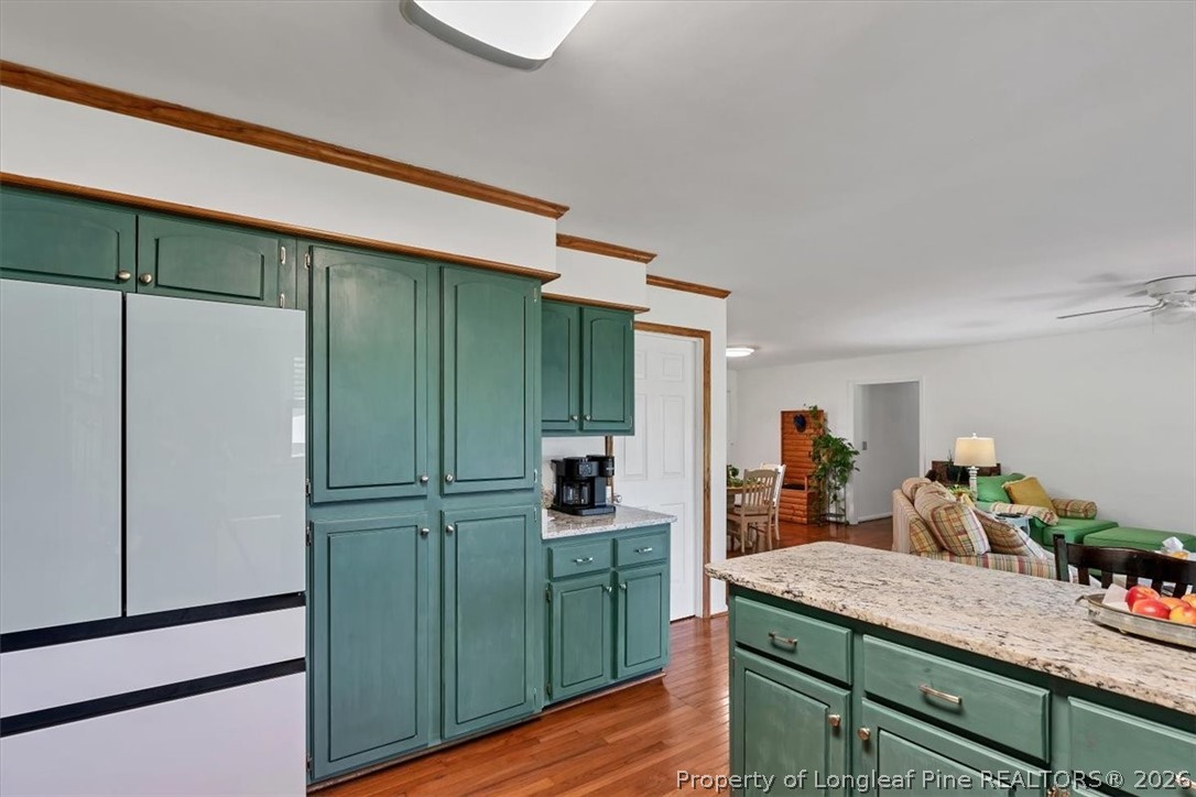 7266 Pleasant Hope Road Fairmont, NC 28340 - Photo 12 of 45 a kitchen with kitchen island a counter top space cabinets and stainless steel appliances