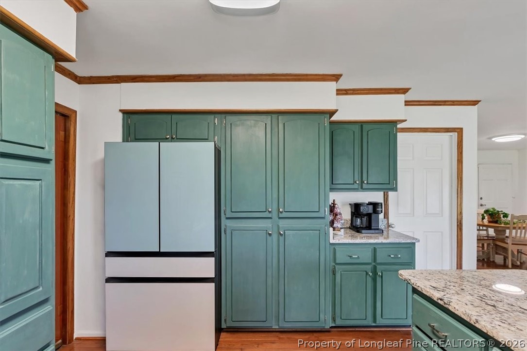 7266 Pleasant Hope Road Fairmont, NC 28340 - Photo 13 of 45 a kitchen with a refrigerator a sink and cabinets