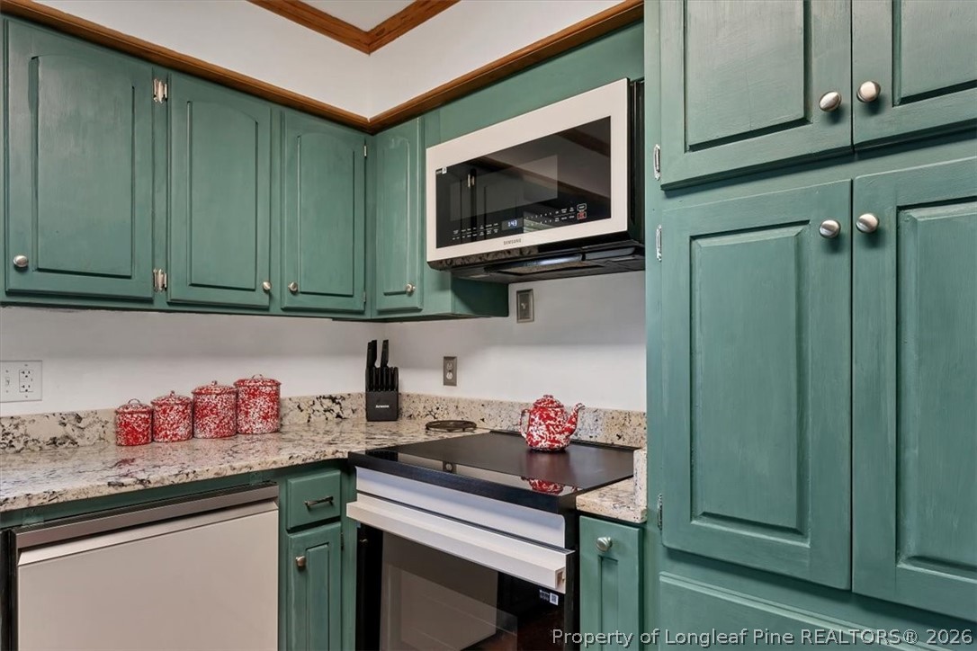 7266 Pleasant Hope Road Fairmont, NC 28340 - Photo 14 of 45 a kitchen with granite countertop cabinets a sink and dishwasher