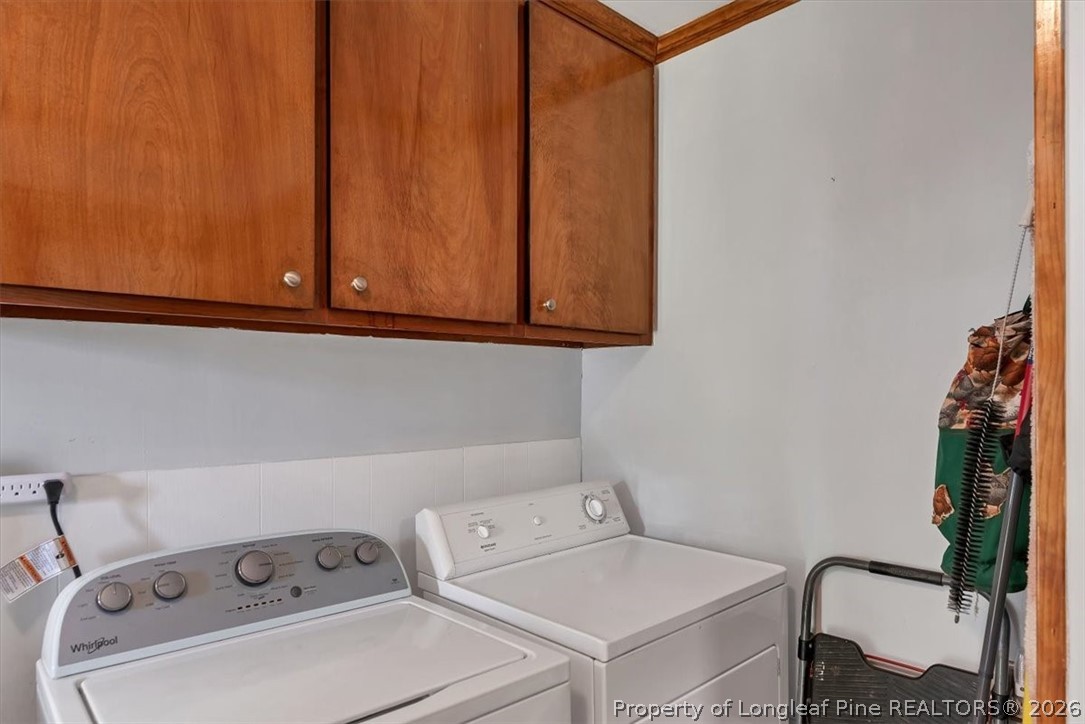 7266 Pleasant Hope Road Fairmont, NC 28340 - Photo 16 of 45 a utility room with dryer and washer